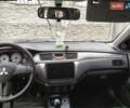 Серый Мицубиси Лансер, объемом двигателя 1.6 л и пробегом 245 тыс. км за 4750 $, фото 1 на Automoto.ua