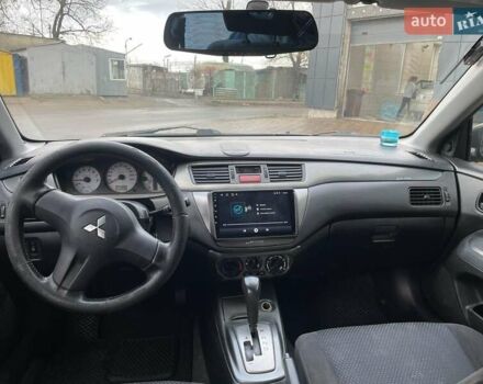 Сірий Міцубісі Lancer, об'ємом двигуна 1.6 л та пробігом 262 тис. км за 4400 $, фото 10 на Automoto.ua