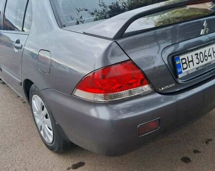 Сірий Міцубісі Lancer, об'ємом двигуна 1.6 л та пробігом 229 тис. км за 4900 $, фото 32 на Automoto.ua