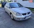 Сірий Міцубісі Lancer, об'ємом двигуна 1.6 л та пробігом 230 тис. км за 2550 $, фото 1 на Automoto.ua