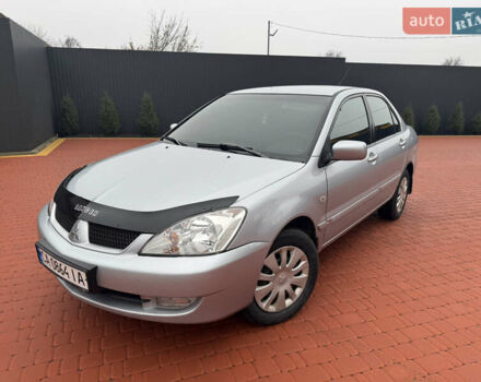 Серый Мицубиси Лансер, объемом двигателя 1.6 л и пробегом 242 тыс. км за 4300 $, фото 1 на Automoto.ua