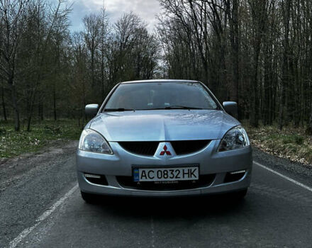 Сірий Міцубісі Lancer, об'ємом двигуна 1.58 л та пробігом 216 тис. км за 4750 $, фото 1 на Automoto.ua