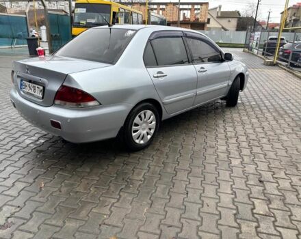 Серый Мицубиси Лансер, объемом двигателя 1.6 л и пробегом 260 тыс. км за 4999 $, фото 1 на Automoto.ua