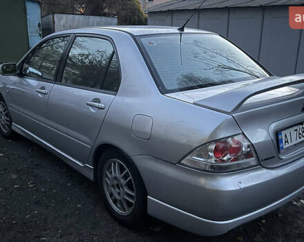 Серый Мицубиси Лансер, объемом двигателя 2 л и пробегом 307 тыс. км за 3999 $, фото 14 на Automoto.ua