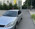 Серый Мицубиси Лансер, объемом двигателя 1.6 л и пробегом 320 тыс. км за 3700 $, фото 2 на Automoto.ua
