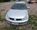 Сірий Міцубісі Lancer, об'ємом двигуна 1.58 л та пробігом 302 тис. км за 3200 $, фото 1 на Automoto.ua