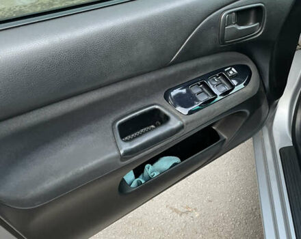 Сірий Міцубісі Lancer, об'ємом двигуна 1.58 л та пробігом 430 тис. км за 2550 $, фото 14 на Automoto.ua