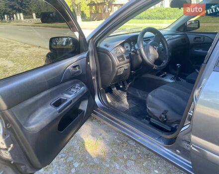 Серый Мицубиси Лансер, объемом двигателя 1.6 л и пробегом 291 тыс. км за 3900 $, фото 6 на Automoto.ua