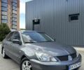 Серый Мицубиси Лансер, объемом двигателя 1.58 л и пробегом 160 тыс. км за 4600 $, фото 18 на Automoto.ua