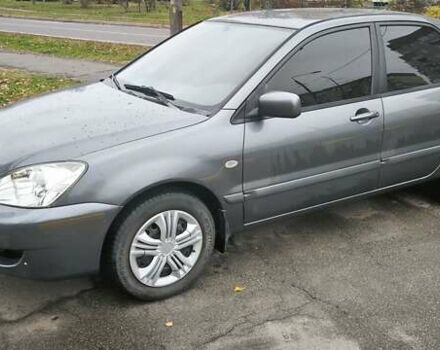 Серый Мицубиси Лансер, объемом двигателя 1.6 л и пробегом 263 тыс. км за 3800 $, фото 1 на Automoto.ua