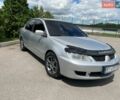 Серый Мицубиси Лансер, объемом двигателя 1.6 л и пробегом 257 тыс. км за 3999 $, фото 1 на Automoto.ua