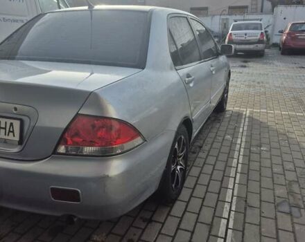 Серый Мицубиси Лансер, объемом двигателя 1.58 л и пробегом 301 тыс. км за 3500 $, фото 3 на Automoto.ua