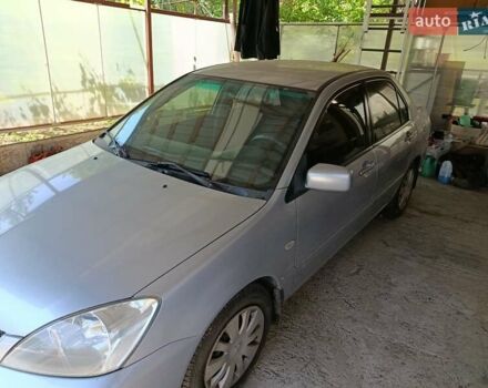 Сірий Міцубісі Lancer, об'ємом двигуна 1.58 л та пробігом 186 тис. км за 4300 $, фото 12 на Automoto.ua