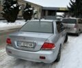 Серый Мицубиси Лансер, объемом двигателя 1.6 л и пробегом 250 тыс. км за 3300 $, фото 1 на Automoto.ua
