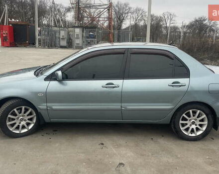 Сірий Міцубісі Lancer, об'ємом двигуна 1.58 л та пробігом 267 тис. км за 5300 $, фото 5 на Automoto.ua