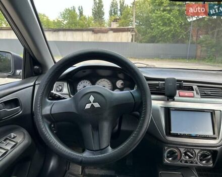 Серый Мицубиси Лансер, объемом двигателя 1.58 л и пробегом 160 тыс. км за 4600 $, фото 13 на Automoto.ua