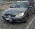 Серый Мицубиси Лансер, объемом двигателя 1.6 л и пробегом 268 тыс. км за 1499 $, фото 1 на Automoto.ua