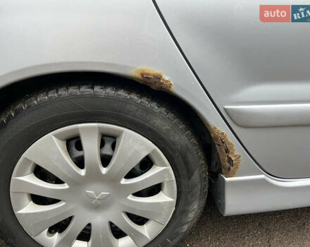 Сірий Міцубісі Lancer, об'ємом двигуна 1.58 л та пробігом 308 тис. км за 3700 $, фото 17 на Automoto.ua