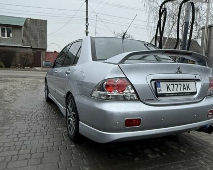 Серый Мицубиси Лансер, объемом двигателя 2 л и пробегом 256 тыс. км за 7000 $, фото 5 на Automoto.ua