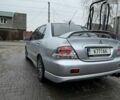 Серый Мицубиси Лансер, объемом двигателя 2 л и пробегом 256 тыс. км за 7000 $, фото 5 на Automoto.ua