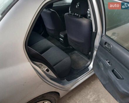 Серый Мицубиси Лансер, объемом двигателя 1.58 л и пробегом 215 тыс. км за 4000 $, фото 14 на Automoto.ua