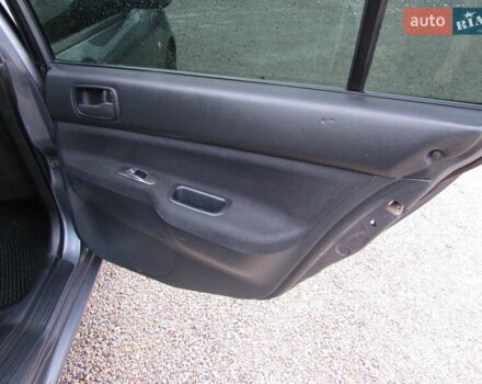 Серый Мицубиси Лансер, объемом двигателя 1.58 л и пробегом 300 тыс. км за 3600 $, фото 12 на Automoto.ua