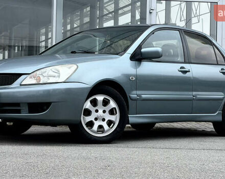 Сірий Міцубісі Lancer, об'ємом двигуна 1.58 л та пробігом 275 тис. км за 4600 $, фото 9 на Automoto.ua