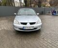 Серый Мицубиси Лансер, объемом двигателя 1.6 л и пробегом 260 тыс. км за 4999 $, фото 1 на Automoto.ua