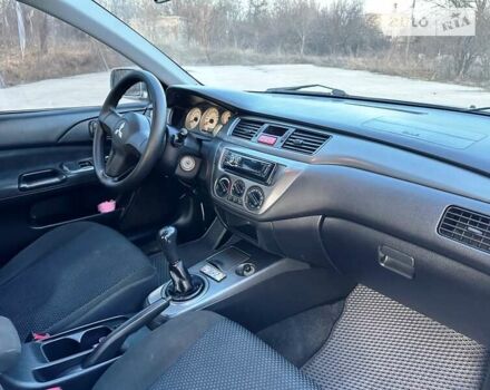 Сірий Міцубісі Lancer, об'ємом двигуна 1.58 л та пробігом 211 тис. км за 4900 $, фото 23 на Automoto.ua