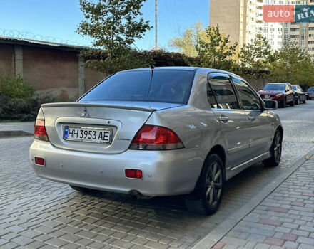 Серый Мицубиси Лансер, объемом двигателя 1.58 л и пробегом 244 тыс. км за 4950 $, фото 5 на Automoto.ua