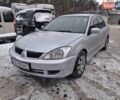 Серый Мицубиси Лансер, объемом двигателя 1.6 л и пробегом 245 тыс. км за 3999 $, фото 1 на Automoto.ua