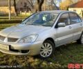 Сірий Міцубісі Lancer, об'ємом двигуна 1.6 л та пробігом 250 тис. км за 4000 $, фото 1 на Automoto.ua