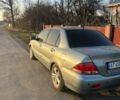 Серый Мицубиси Лансер, объемом двигателя 1.58 л и пробегом 290 тыс. км за 3000 $, фото 2 на Automoto.ua