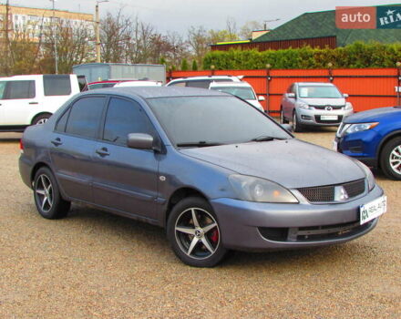 Серый Мицубиси Лансер, объемом двигателя 1.58 л и пробегом 300 тыс. км за 3600 $, фото 3 на Automoto.ua