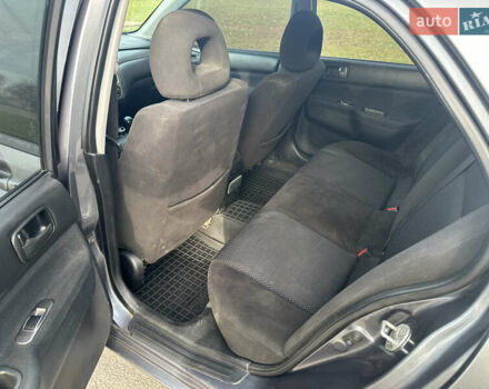 Сірий Міцубісі Lancer, об'ємом двигуна 1.58 л та пробігом 332 тис. км за 4650 $, фото 9 на Automoto.ua