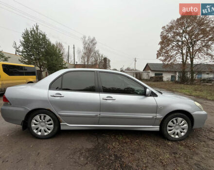 Сірий Міцубісі Lancer, об'ємом двигуна 1.58 л та пробігом 308 тис. км за 3700 $, фото 7 на Automoto.ua