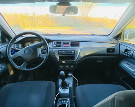 Серый Мицубиси Лансер, объемом двигателя 1.6 л и пробегом 253 тыс. км за 2350 $, фото 5 на Automoto.ua