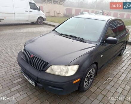 Сірий Міцубісі Lancer, об'ємом двигуна 2 л та пробігом 212 тис. км за 3333 $, фото 3 на Automoto.ua