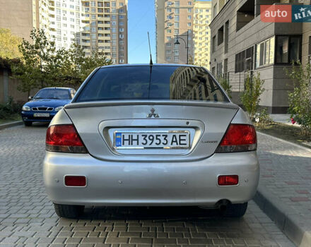 Серый Мицубиси Лансер, объемом двигателя 1.58 л и пробегом 244 тыс. км за 4950 $, фото 6 на Automoto.ua