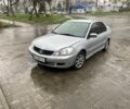 Серый Мицубиси Лансер, объемом двигателя 1.6 л и пробегом 250 тыс. км за 2350 $, фото 1 на Automoto.ua