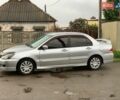 Серый Мицубиси Лансер, объемом двигателя 1.6 л и пробегом 191 тыс. км за 3850 $, фото 1 на Automoto.ua