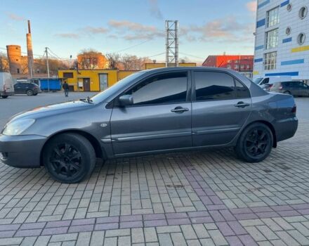 Серый Мицубиси Лансер, объемом двигателя 1.6 л и пробегом 279 тыс. км за 3990 $, фото 3 на Automoto.ua