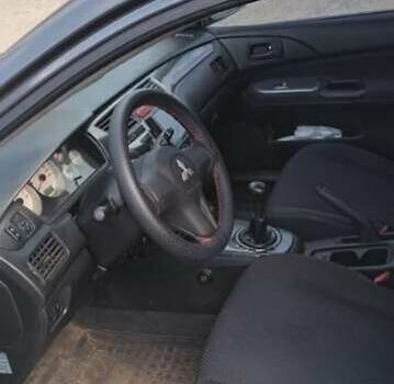 Серый Мицубиси Лансер, объемом двигателя 1.58 л и пробегом 271 тыс. км за 4600 $, фото 7 на Automoto.ua