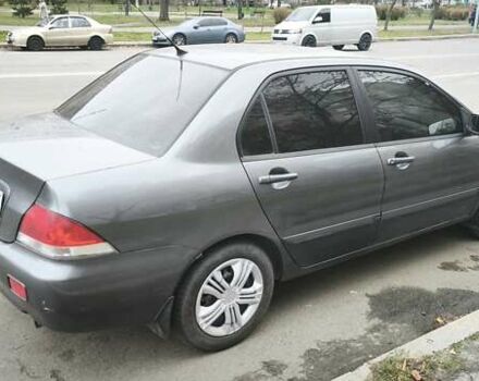 Серый Мицубиси Лансер, объемом двигателя 1.6 л и пробегом 263 тыс. км за 3650 $, фото 6 на Automoto.ua