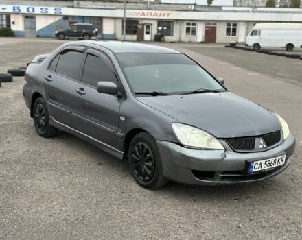 Серый Мицубиси Лансер, объемом двигателя 1.6 л и пробегом 250 тыс. км за 2550 $, фото 2 на Automoto.ua