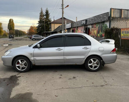 Сірий Міцубісі Lancer, об'ємом двигуна 1.58 л та пробігом 430 тис. км за 2550 $, фото 3 на Automoto.ua
