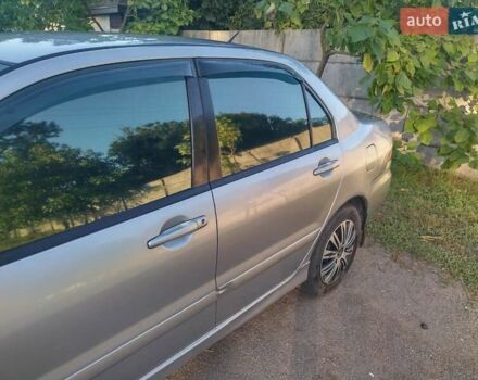 Серый Мицубиси Лансер, объемом двигателя 1.58 л и пробегом 250 тыс. км за 4700 $, фото 19 на Automoto.ua