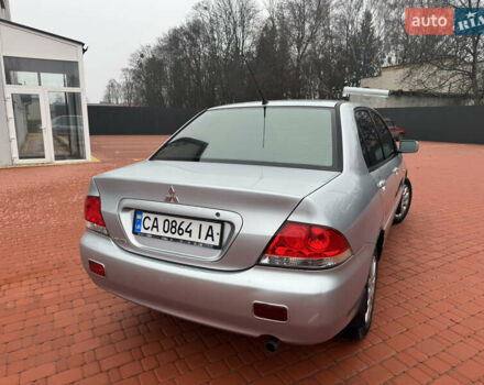 Серый Мицубиси Лансер, объемом двигателя 1.6 л и пробегом 242 тыс. км за 4300 $, фото 3 на Automoto.ua