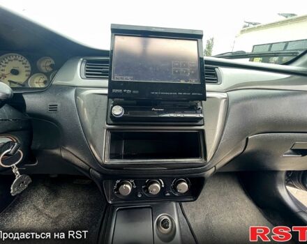 Сірий Міцубісі Lancer, об'ємом двигуна 1.6 л та пробігом 162 тис. км за 4650 $, фото 8 на Automoto.ua