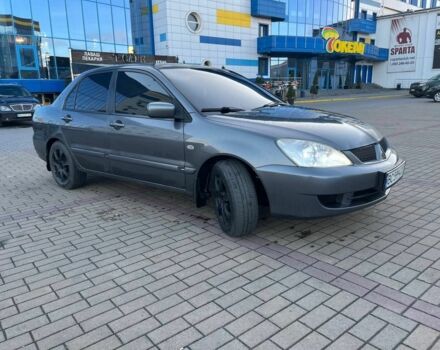 Серый Мицубиси Лансер, объемом двигателя 1.6 л и пробегом 279 тыс. км за 3990 $, фото 1 на Automoto.ua